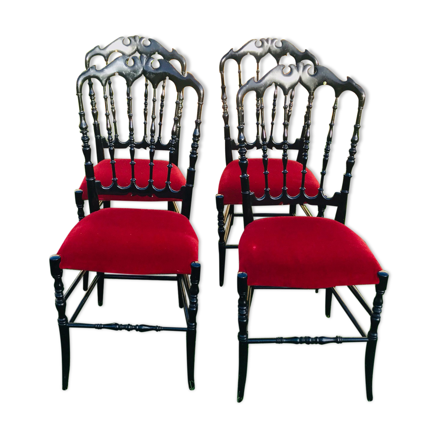 4 black reception chairs with red seats