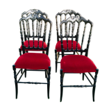 4 black reception chairs with red seats