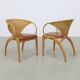 Pair of leather and rattan chairs by Lübke