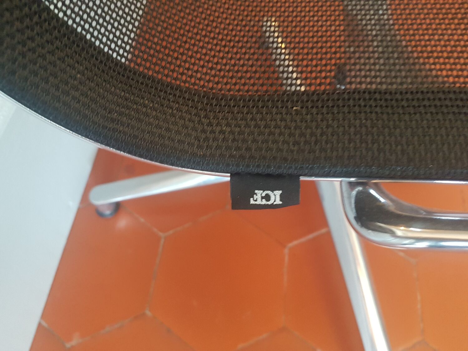 Una Chair armchair in black mesh published by ICF