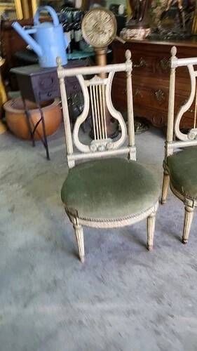 Pair of Louis XVI style chairs from the 18th century with lyre back.