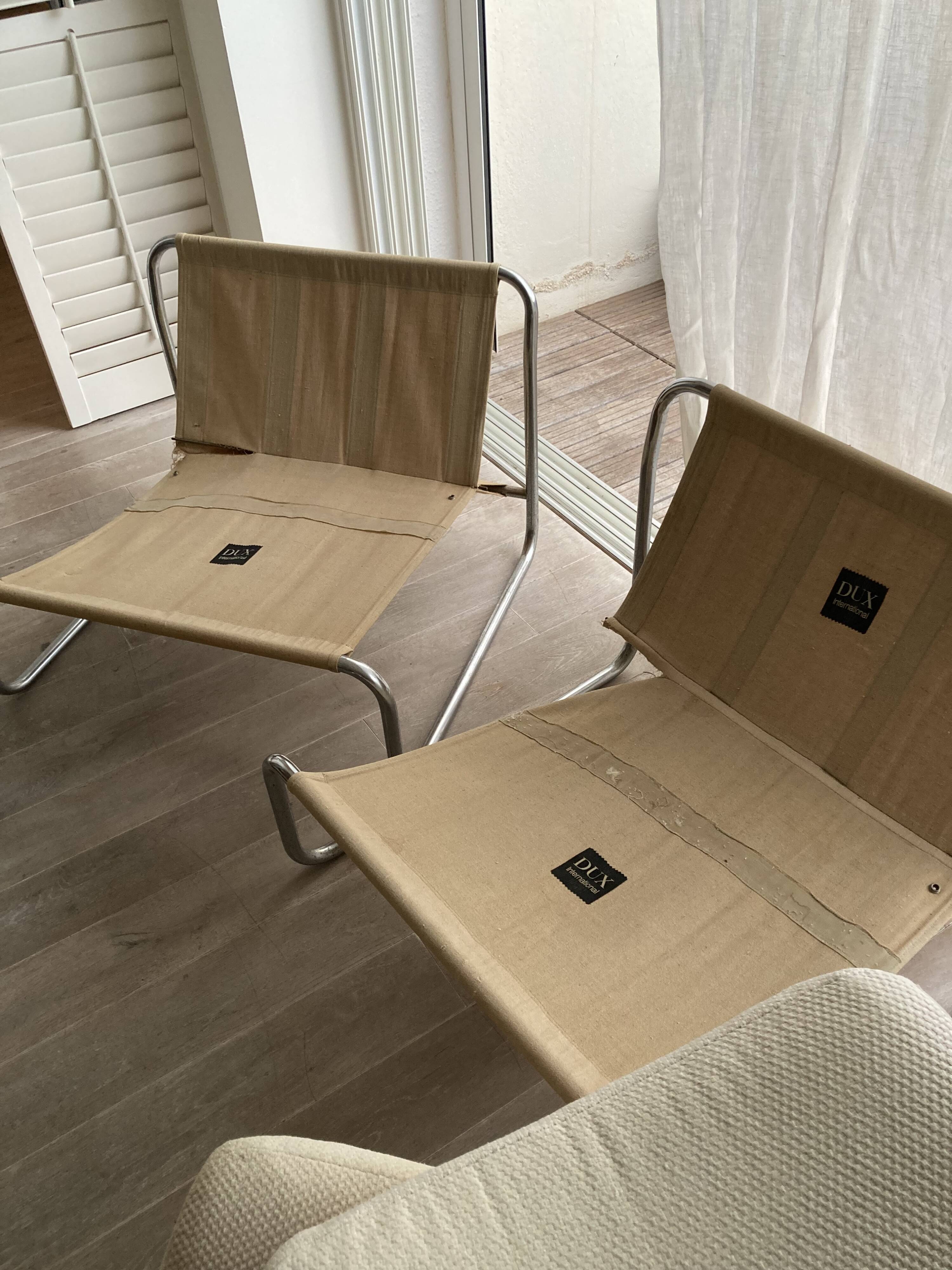 Pair of vintage lounge chairs DUX International from the 60s-70s.