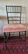 Small Napoléon III chair in black bamboo with a red velvet seat.