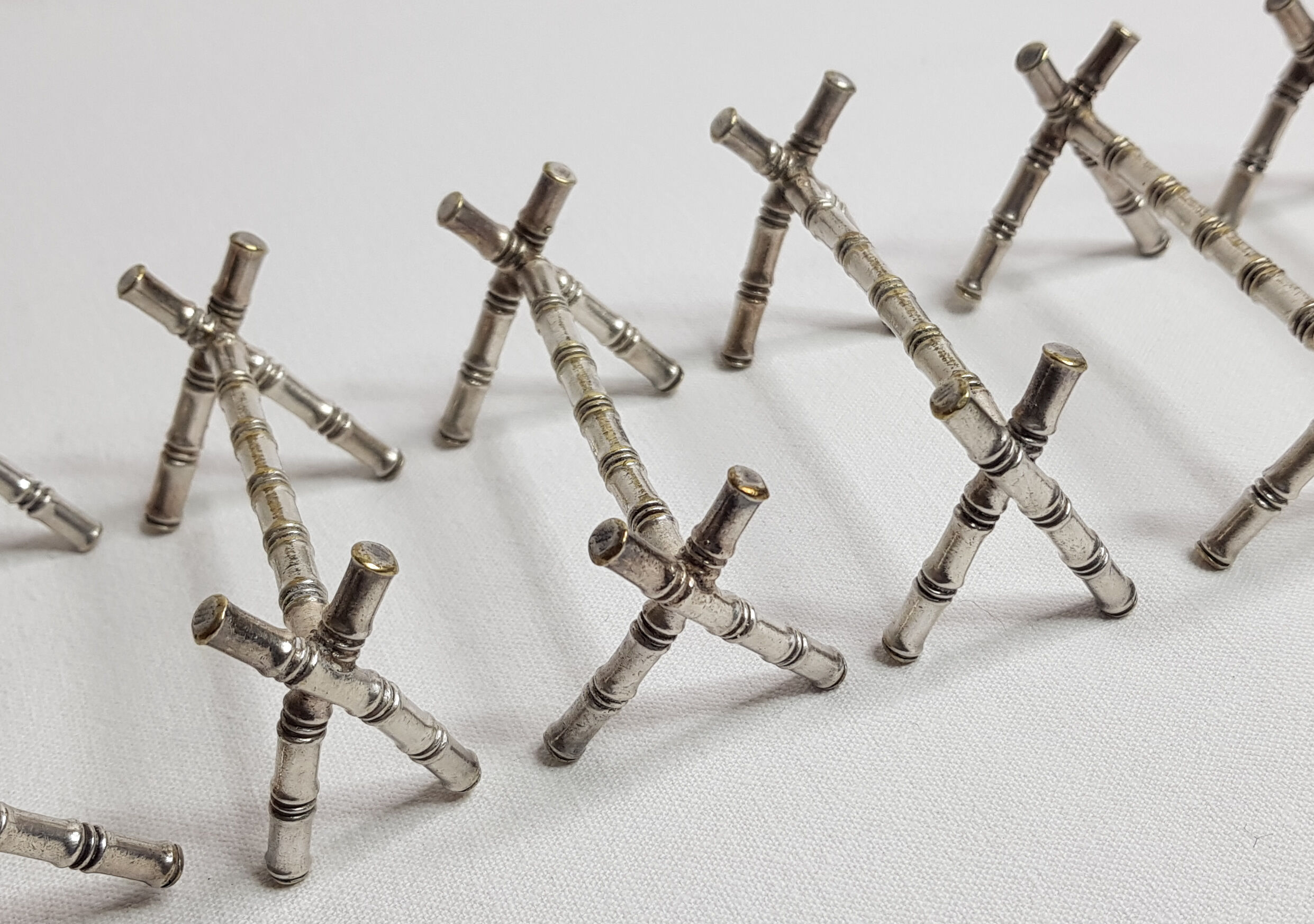 Set of six knife holders in silver metal in imitation of bamboo