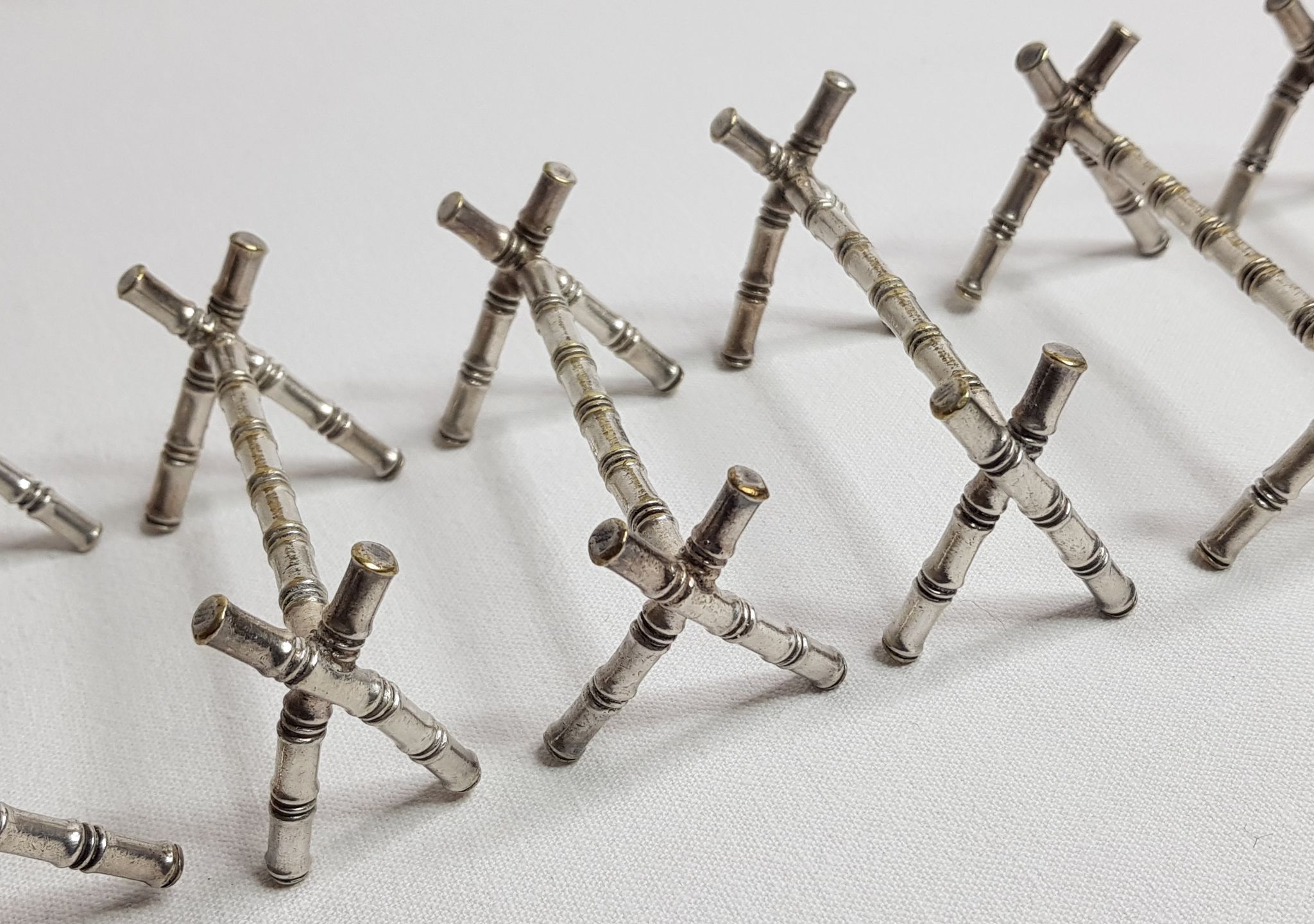 Set of six knife holders in silver metal in imitation of bamboo