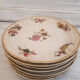 Set of porcelain dessert plates with flower patterns