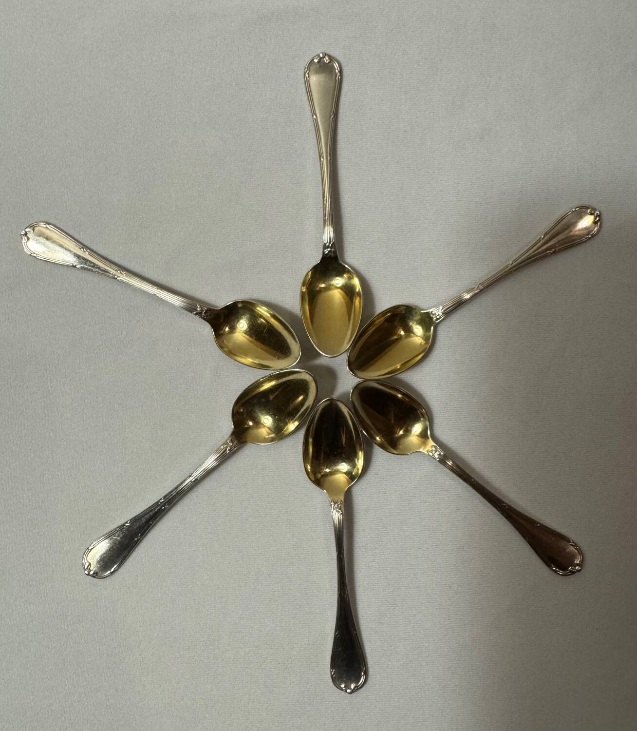 Six Christofle teaspoons, silver-plated vermeil