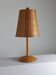 Vintage wooden and brass table lamp by Temde from the 1950s.