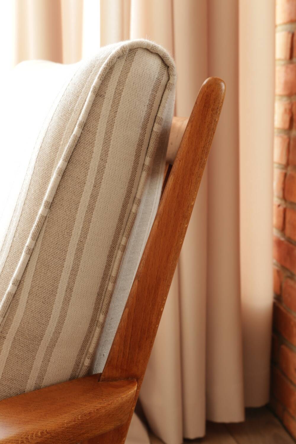 Scandinavian armchair in beige and white striped fabric