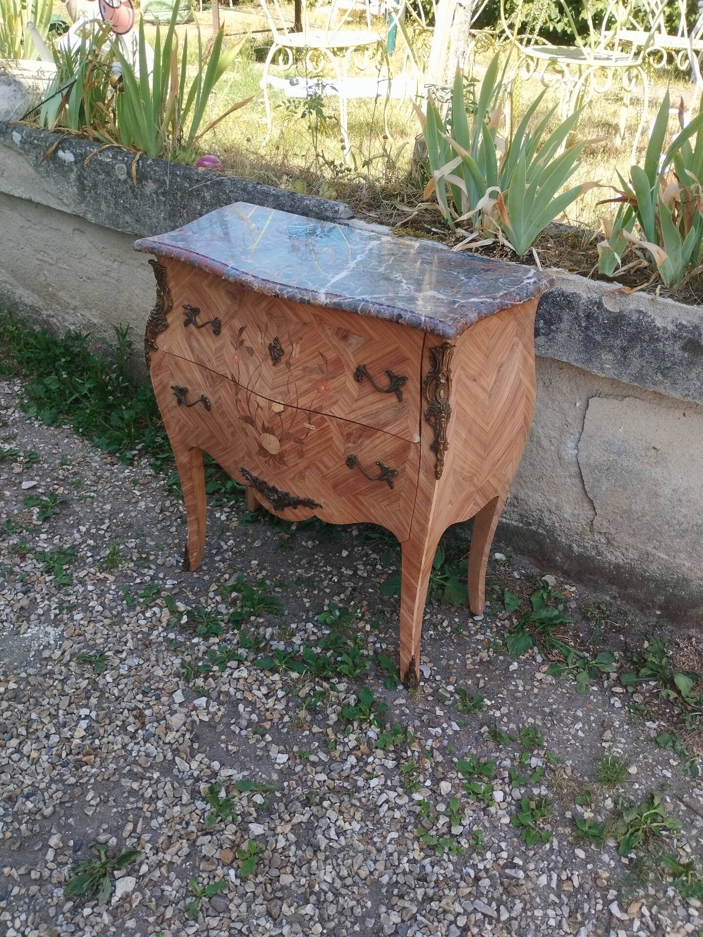 Antique commode in marquetry in the Louis XV style with a marble top.
