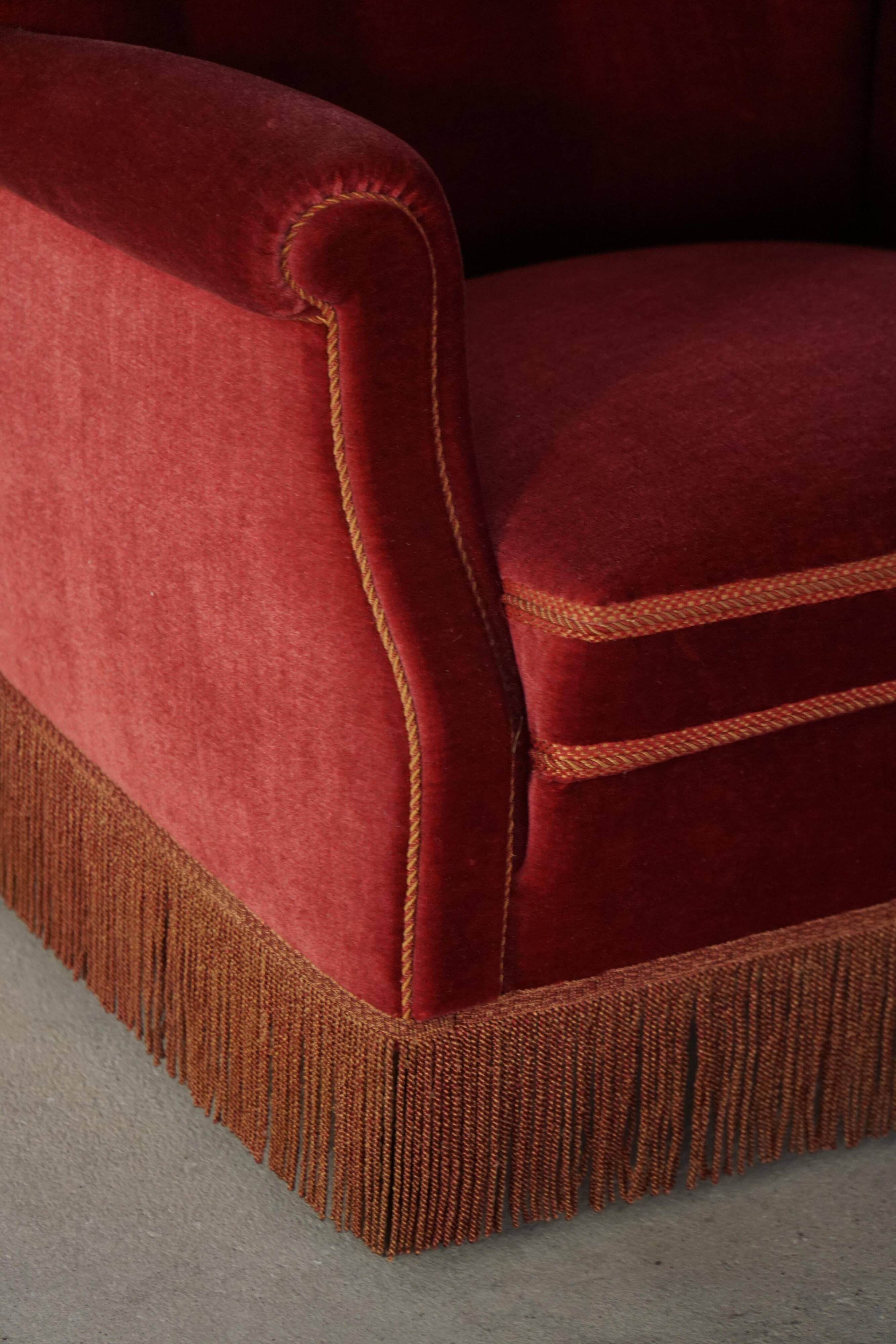 Pair of modern Danish lounge chairs, cherry red velvet, 1950s.