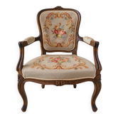 Louis XV style carved wooden armchair with floral needlepoint upholste
