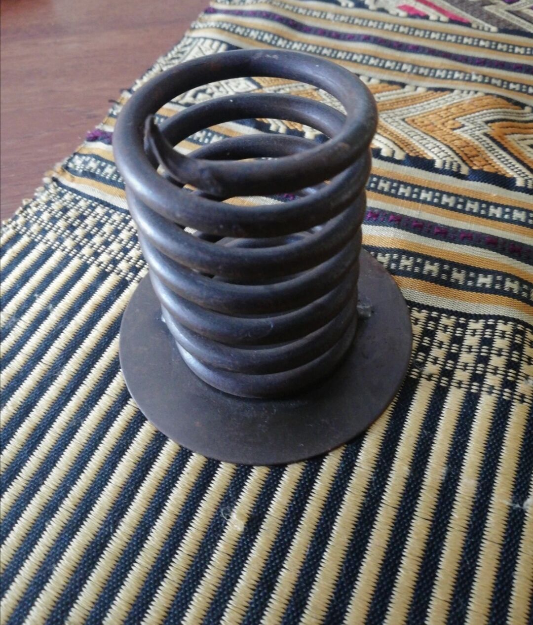 Spiral metal candle holder spring with candle, bronze appearance