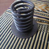 Spiral metal candle holder spring with candle, bronze appearance