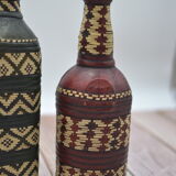 Set of 2 decorative vintage bottles covered with leather & wicker