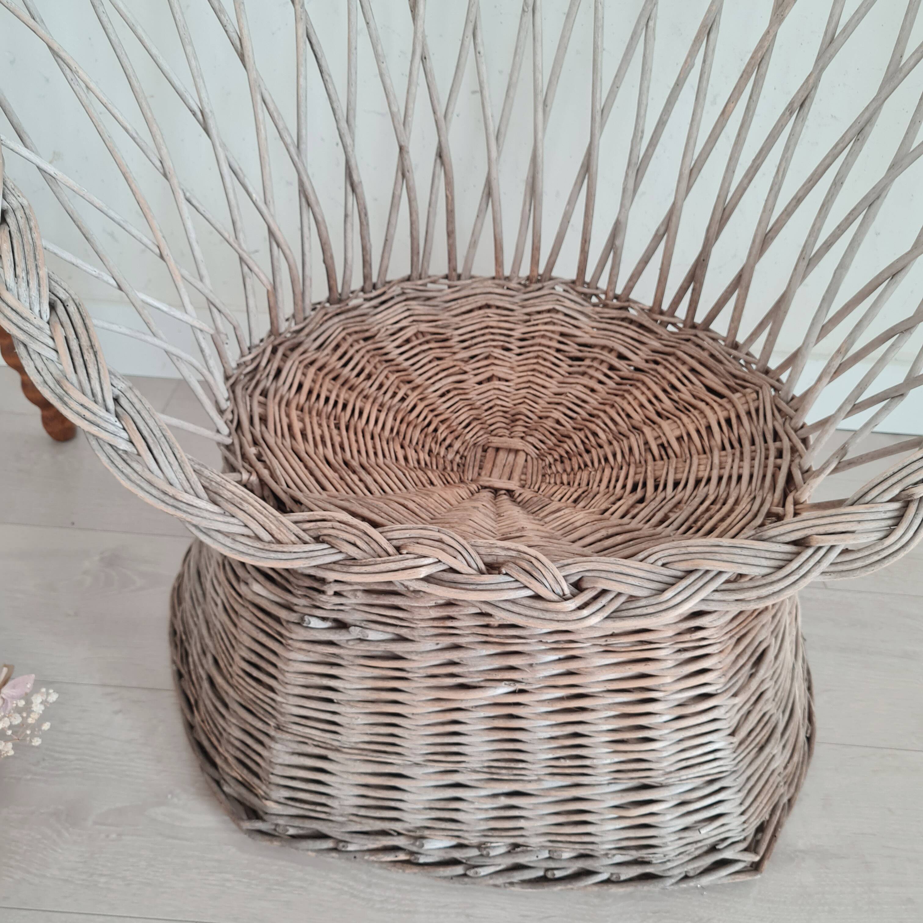 Antique armchair in gray woven wicker