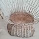 Antique armchair in gray woven wicker
