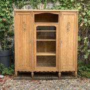Asymmetrical Art Deco glass-fronted Parisian wardrobe in raw oak, 1930.