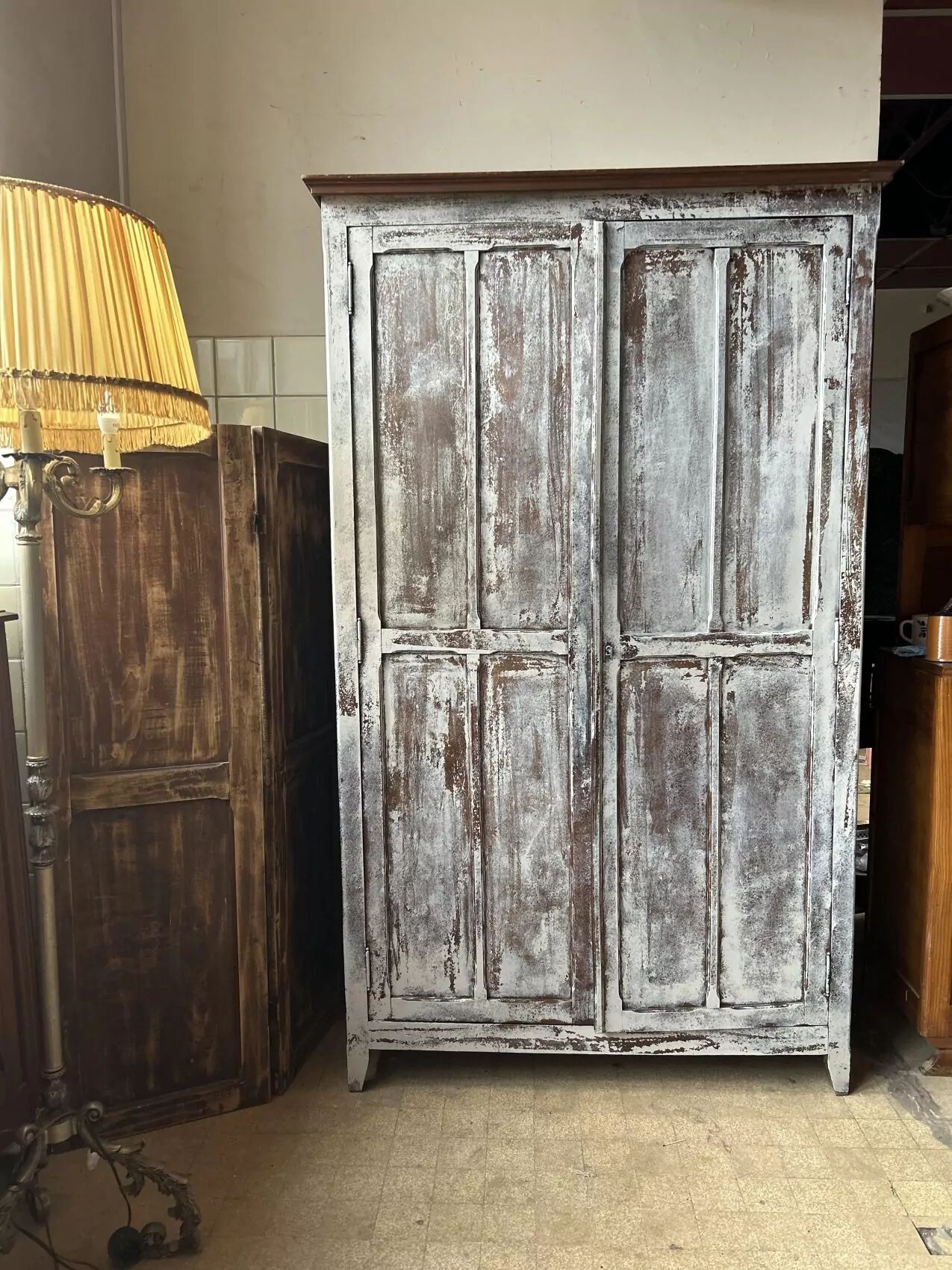 Large Parisian oak wardrobe from the early 20th century with an antique white patina