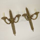 Pair of two-armed Empire wall sconces in gilded bronze