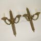 Pair of two-armed Empire wall sconces in gilded bronze