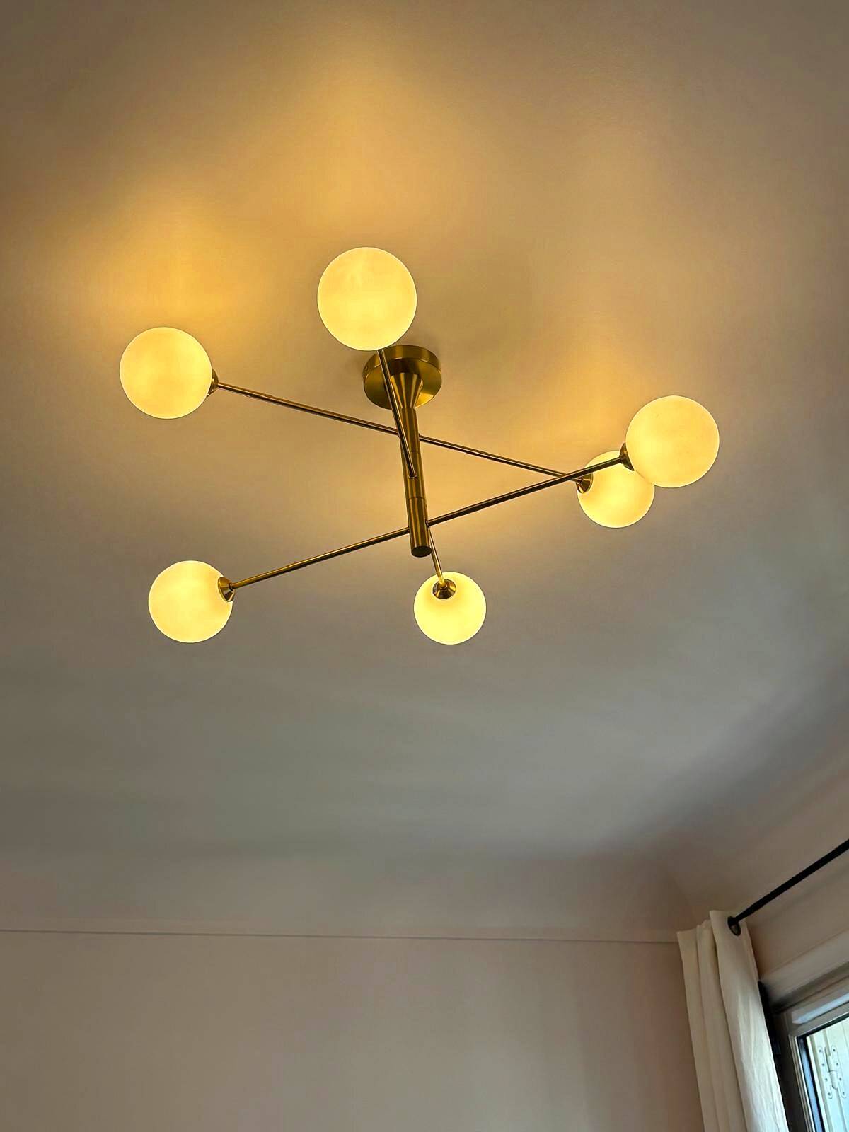 Lustre Cassius with 6 white glass globes and gold metal.