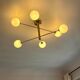 Lustre Cassius with 6 white glass globes and gold metal.