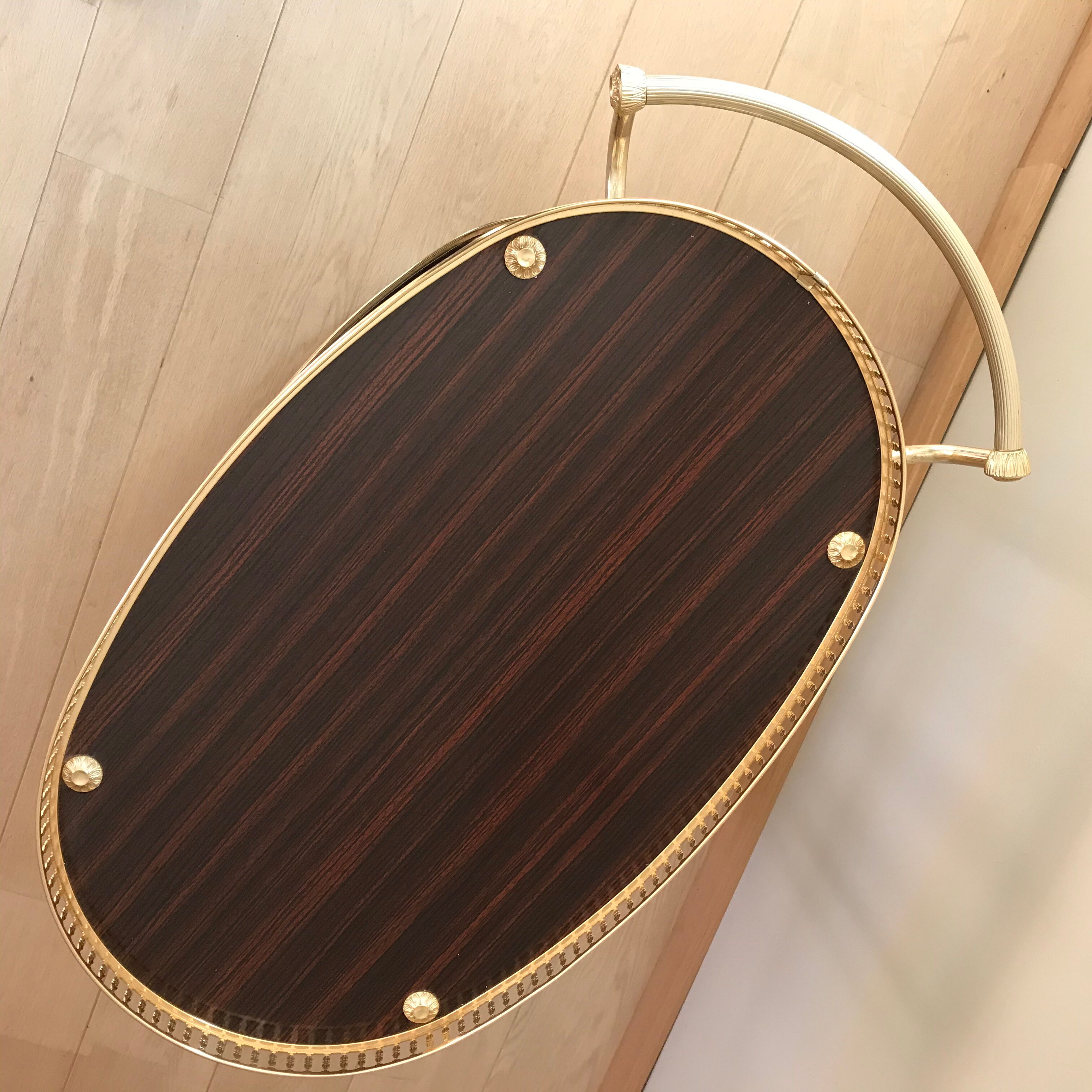 Golden wheeled serving trolley