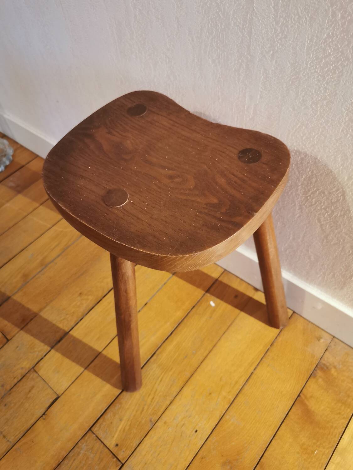 Old wooden tripod bench stool milking shepherd’s bench