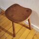 Old wooden tripod bench stool milking shepherd’s bench