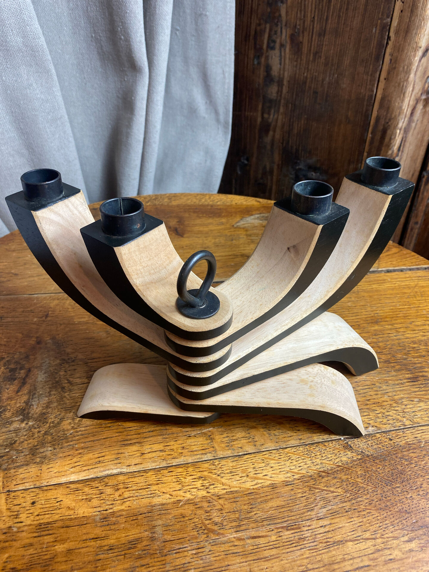 Foldable and deconstructed chandelier, minimalist Swedish design in wood.