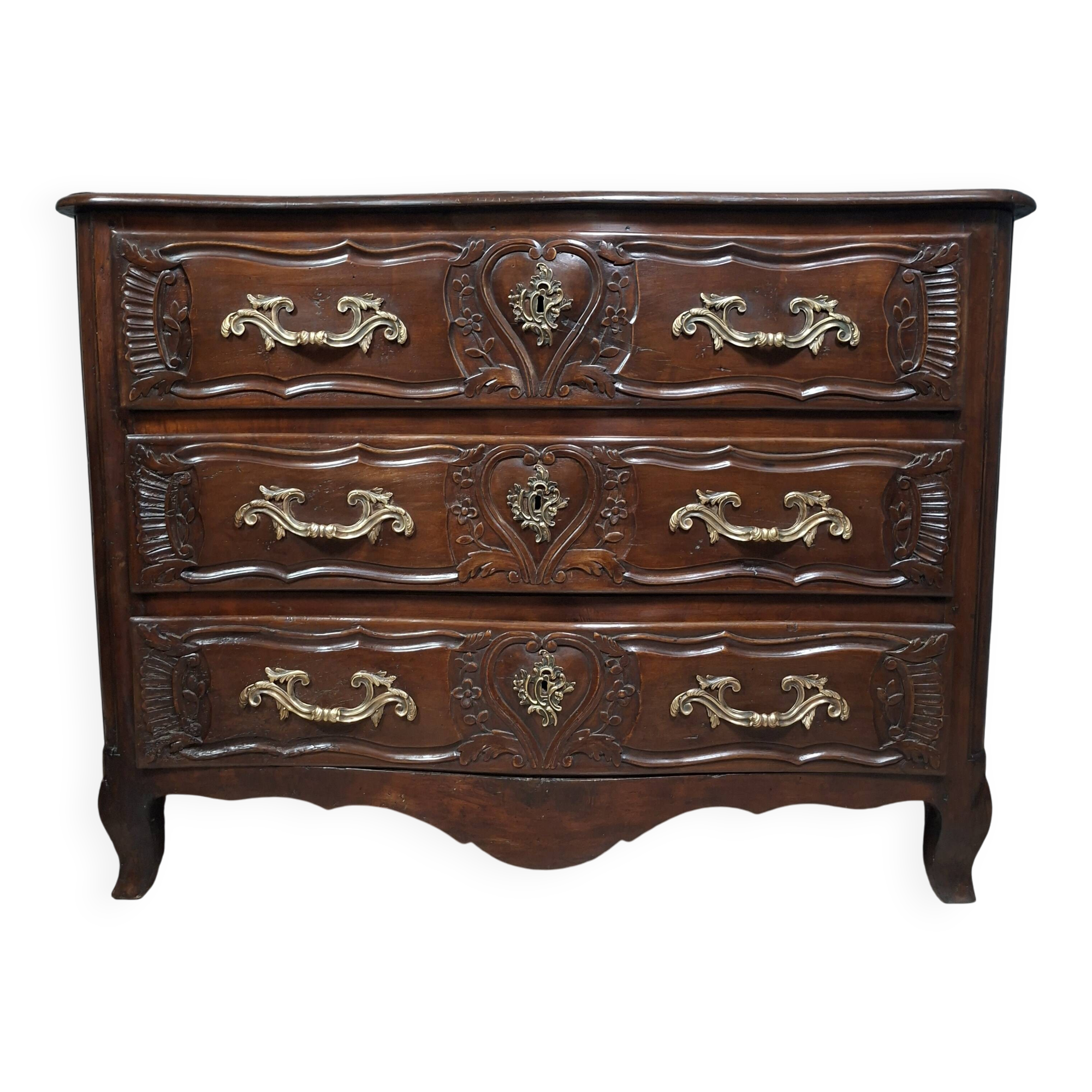 Louis XV/XVIII period Lyonnaise commode in moulded and carved walnut.