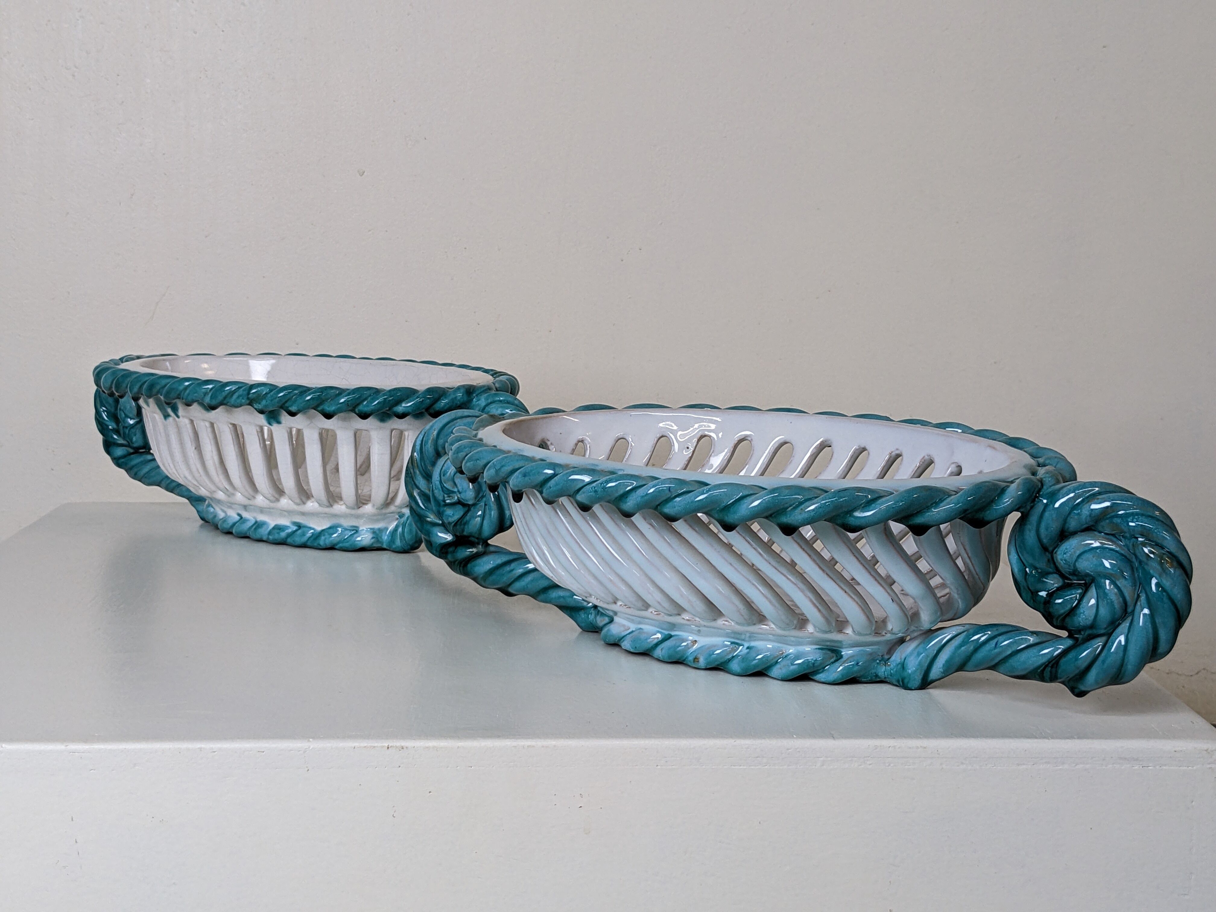 Set of 2 twisted earthenware fruit baskets by Sainte Radegonde, 50s