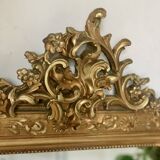 Golden fireplace mirror with pediment