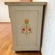 Antique low polychrome sideboard with floral decoration.