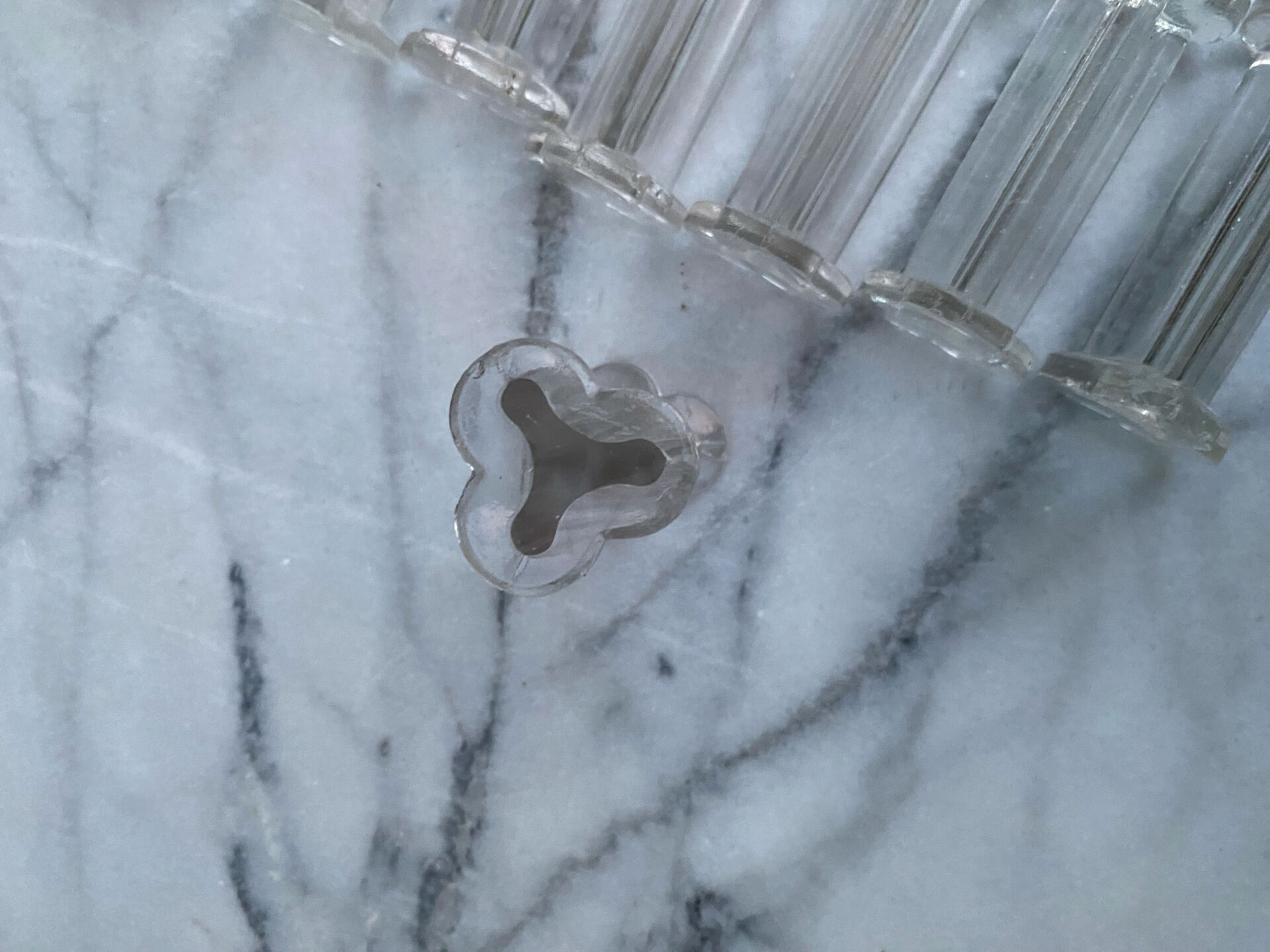 Set of 12 vintage glass knife rests in clear moulded glass.