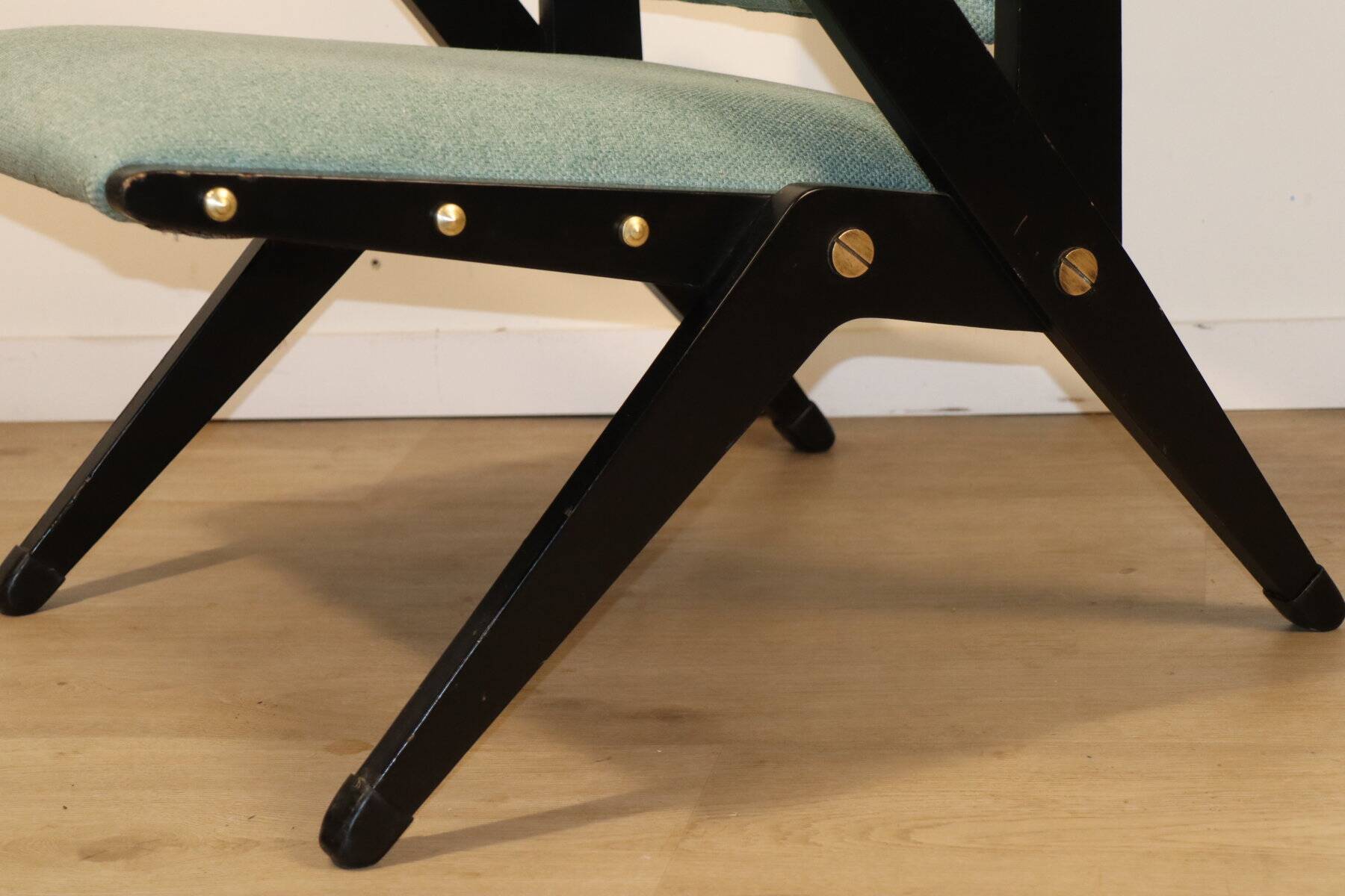 Vintage armchair from the 1960s in black wood and fabric.