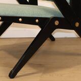 Vintage armchair from the 1960s in black wood and fabric.