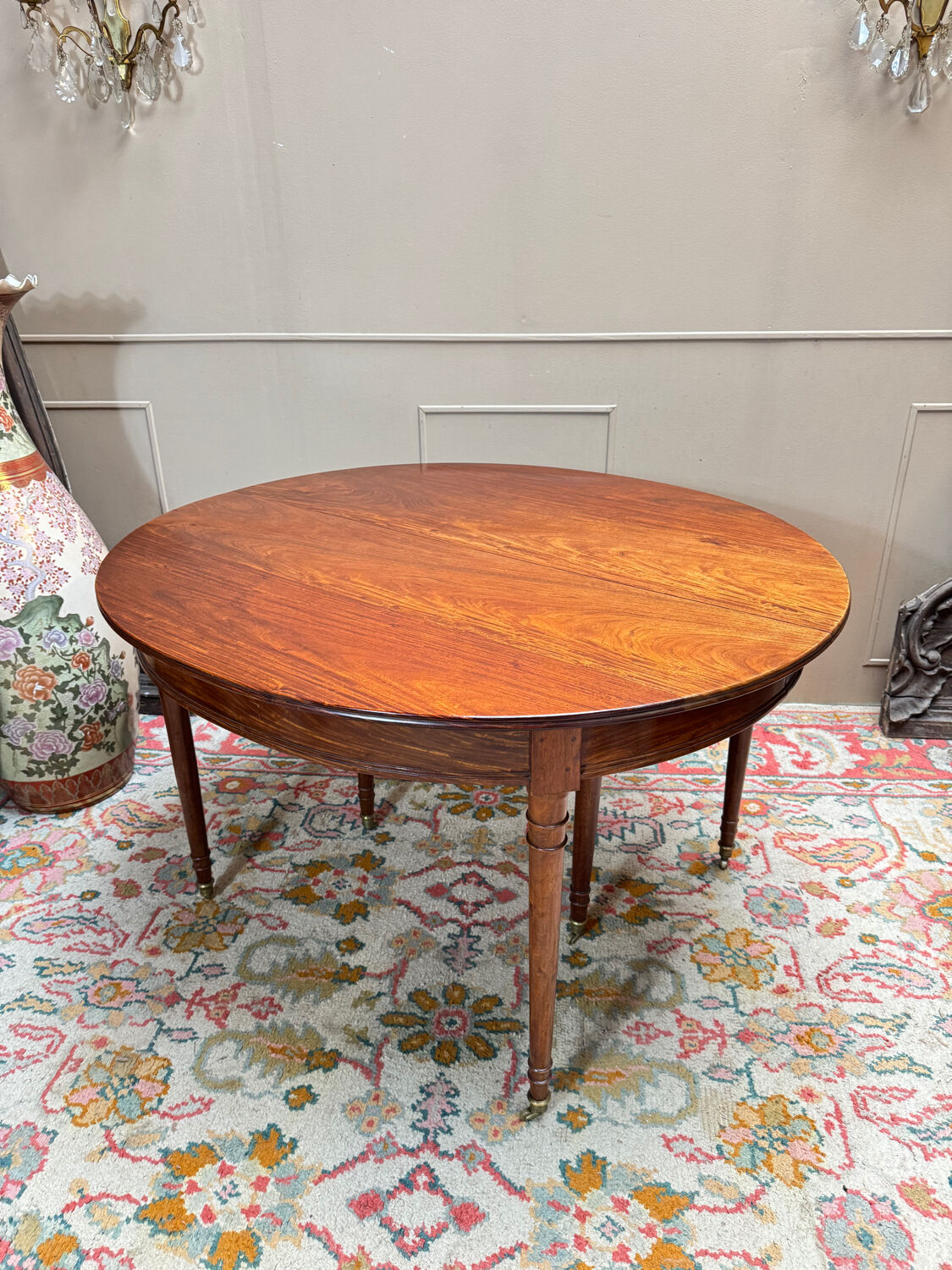 Dining table with a mahogany band in louis xvi style