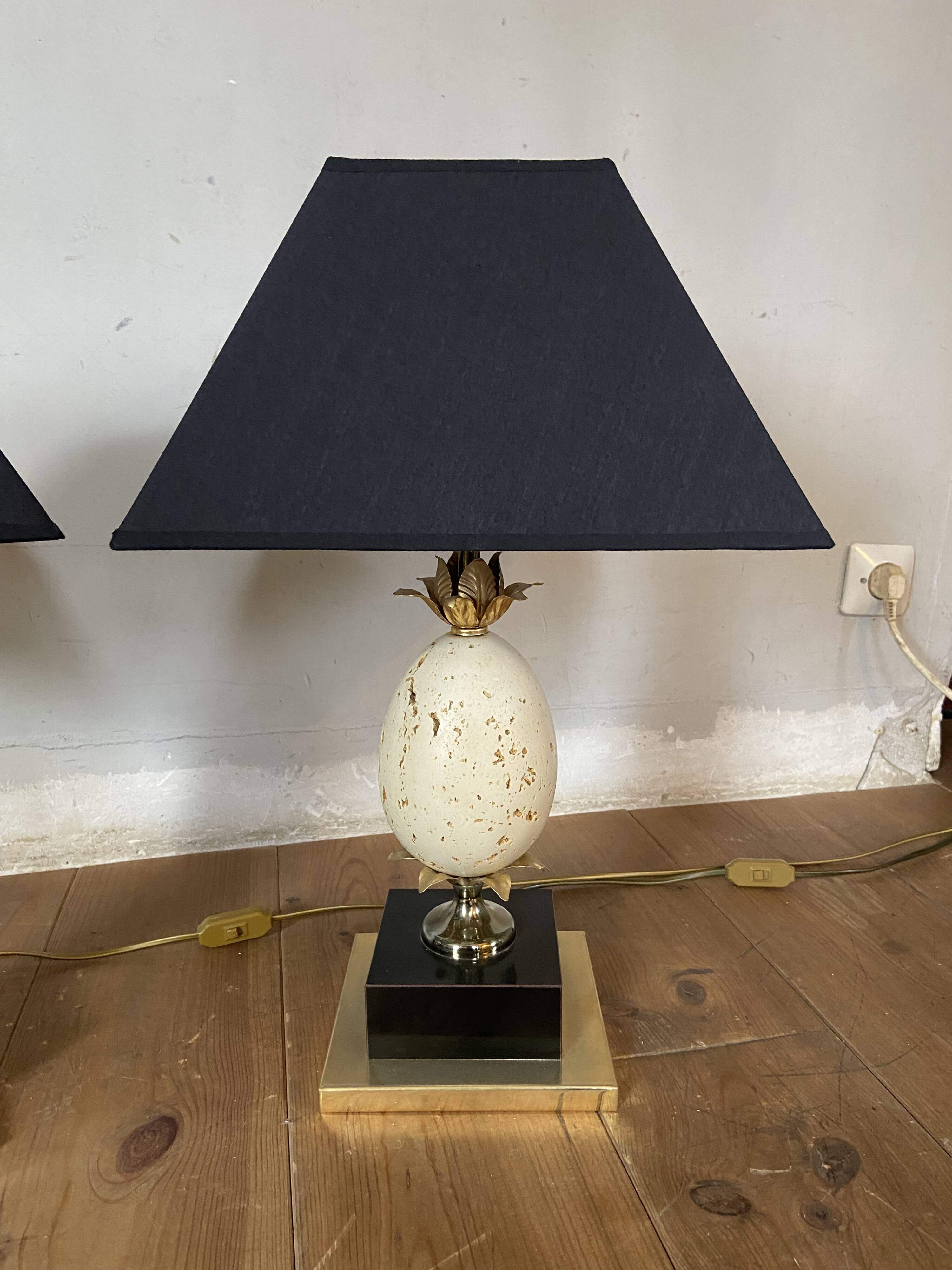 Pair of designer ostrich egg lamps in travertine from maison barbier