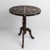 Vintage side table from the early 19th century, dark wood with mother-of-pearl inlays, oval shape with three legs, ethnic style.