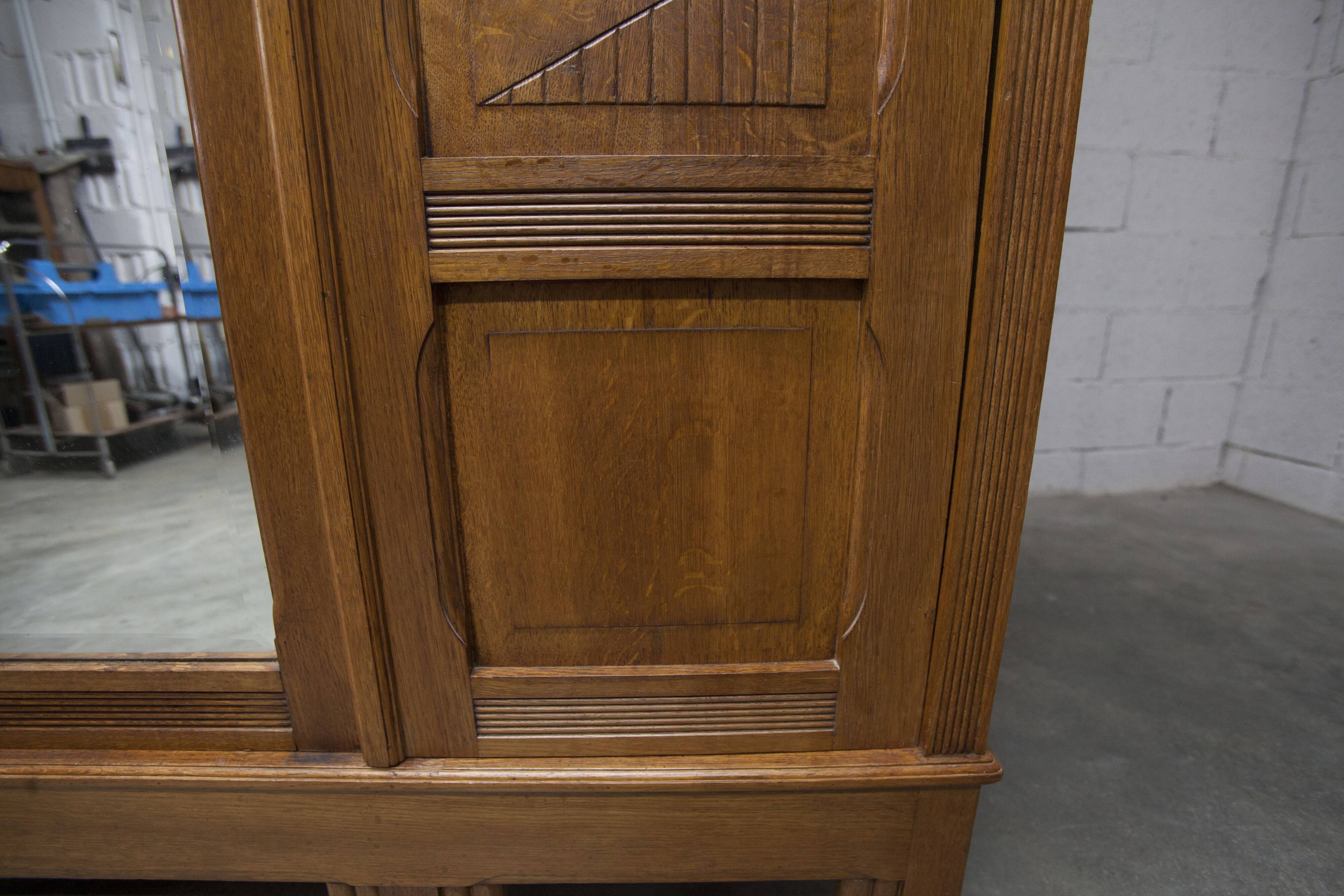 Art Deco carved oak wardrobe - Flemish workshop circa 1930