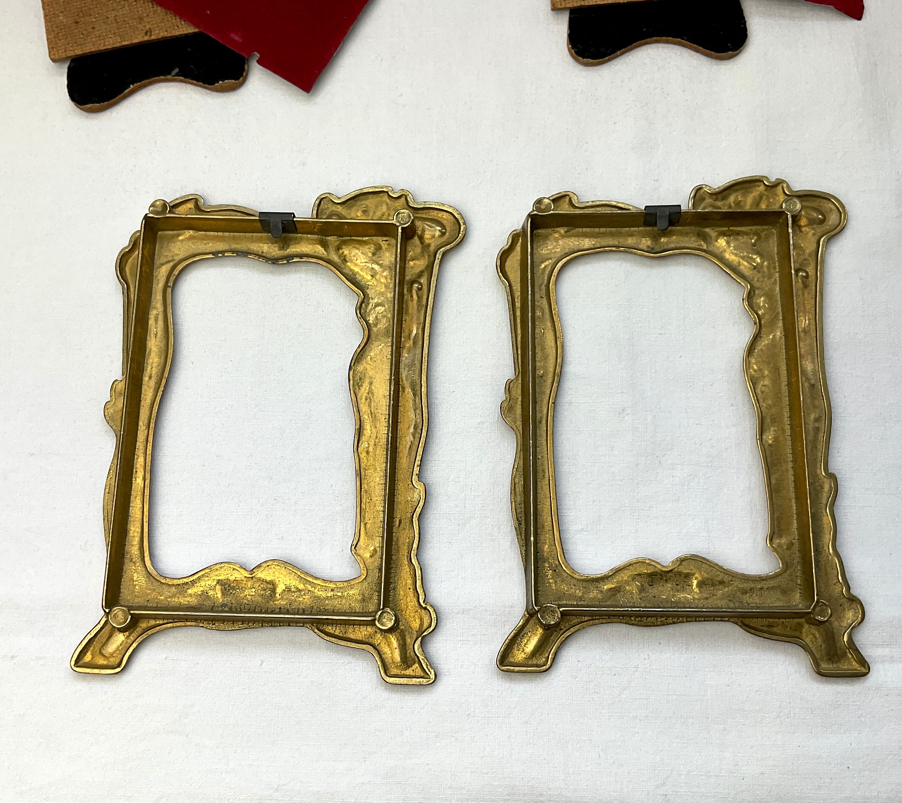Pair of brass frames with Art Nouveau style woman