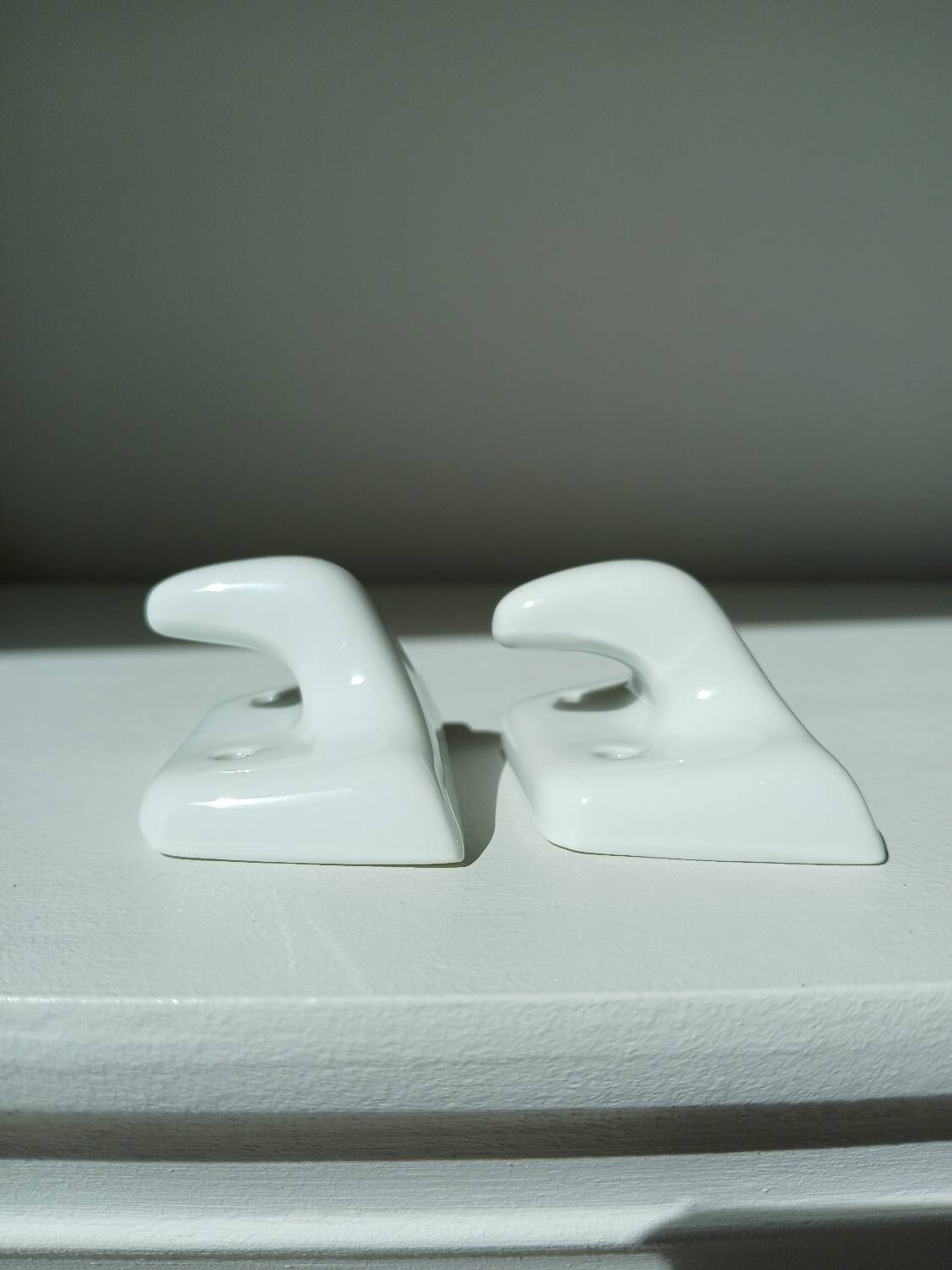 Set of two porcelain tea towel holders