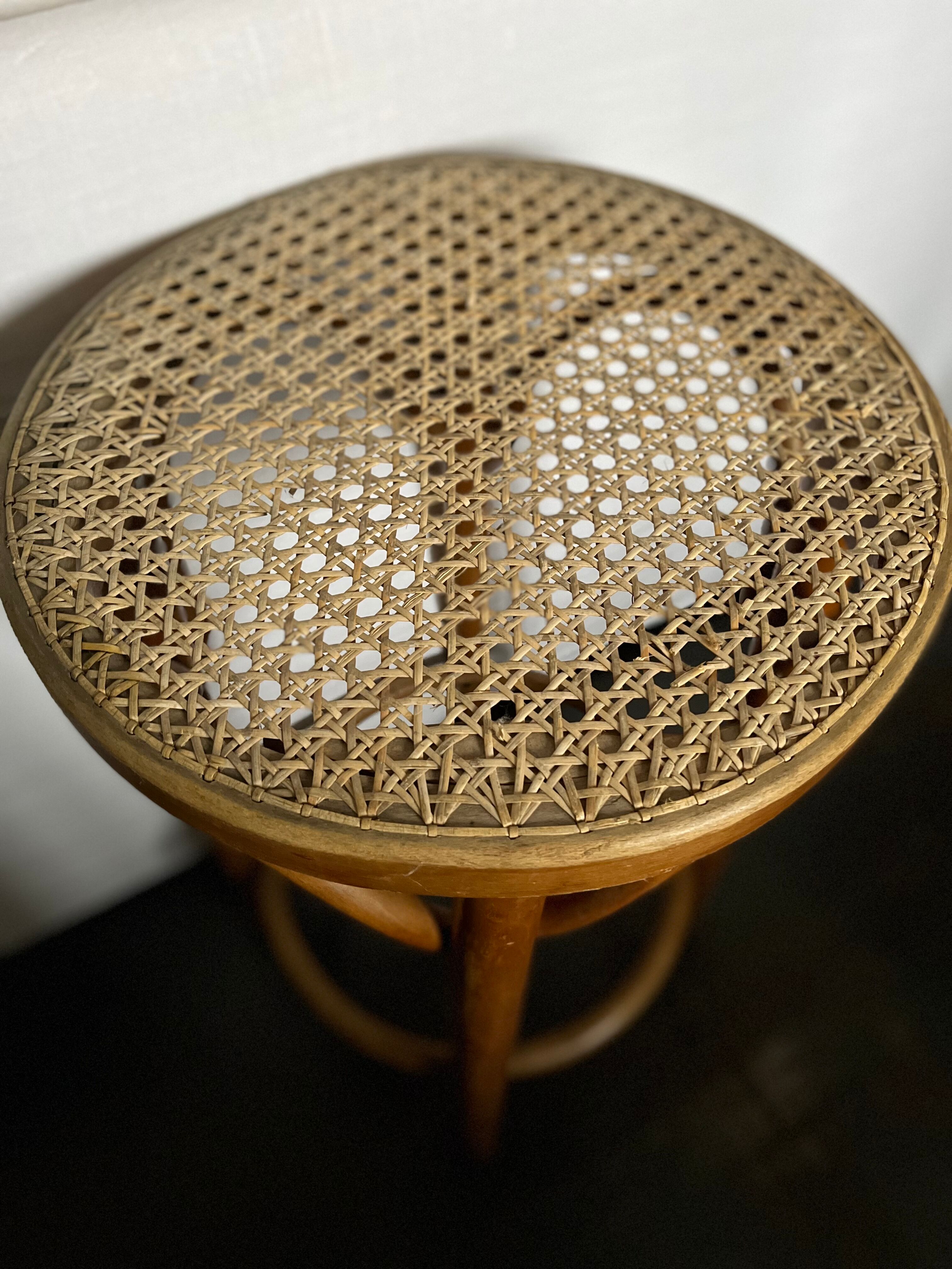 Curved wooden stool and cannage