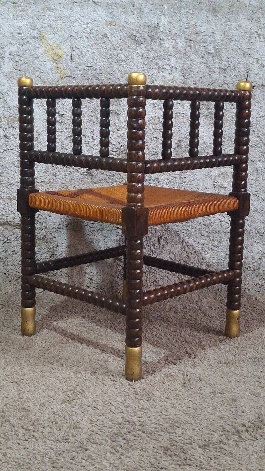 Fireplace corner chair in Louis XIII style, turned wood with braided rush, 19th century.