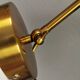 A wall lamp in black and brass-coloured finishes. Danish, early 2000s.