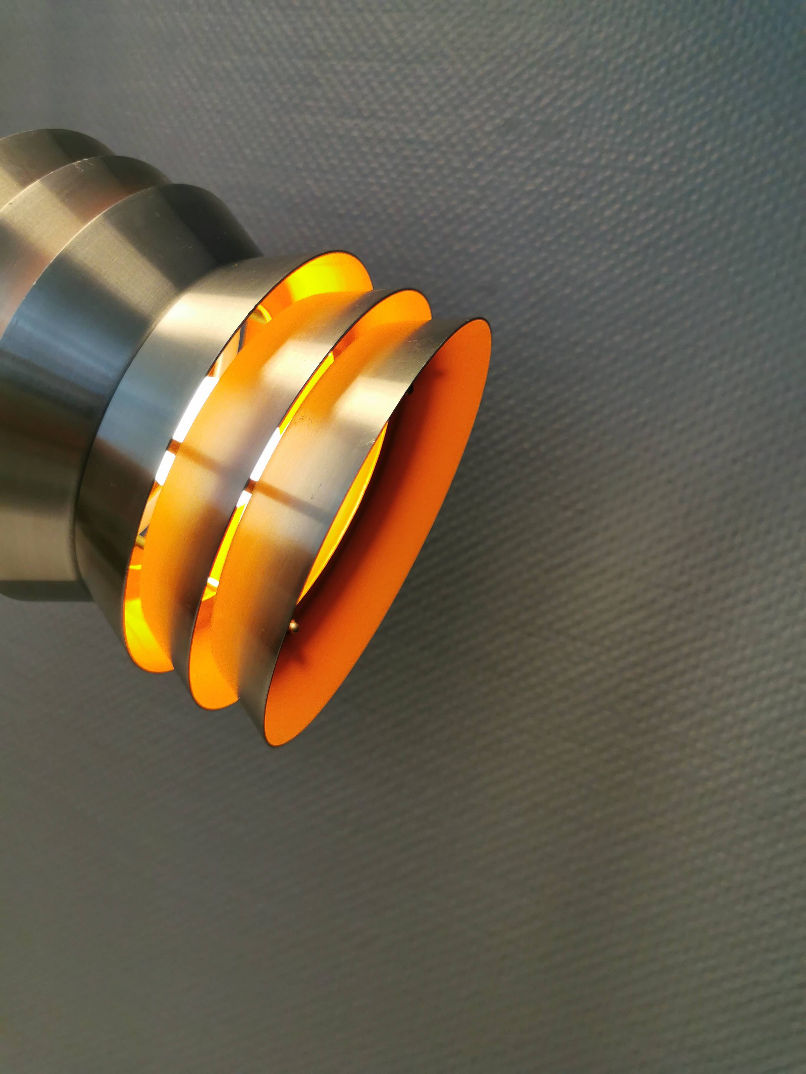 Danish/Swedish hanging lamp, in silver-coloured aluminium with orange interior paint.