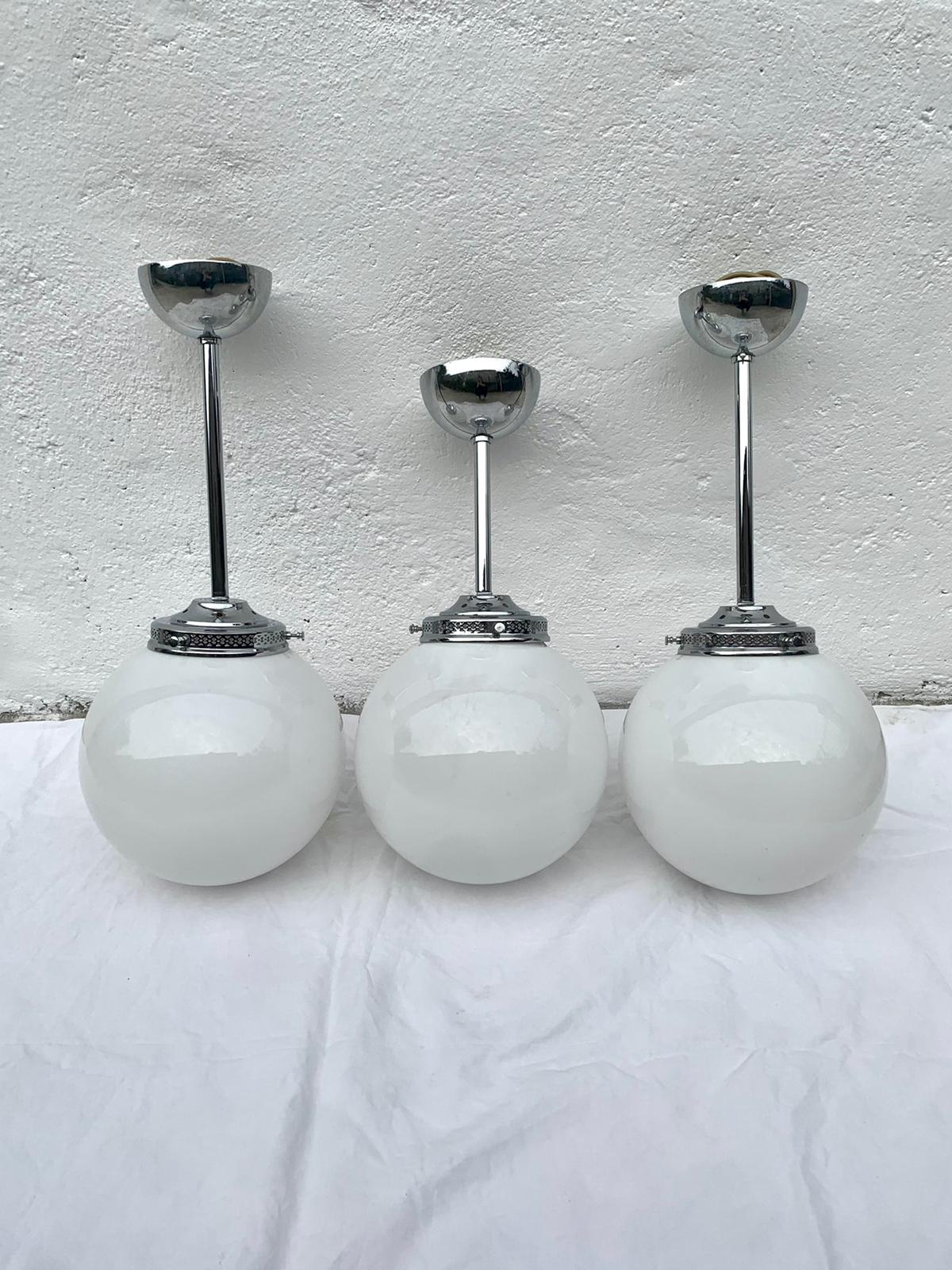 Glass and aluminum globe hanging lamp