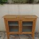 Art Deco sideboard in wood, with 2 glass doors.